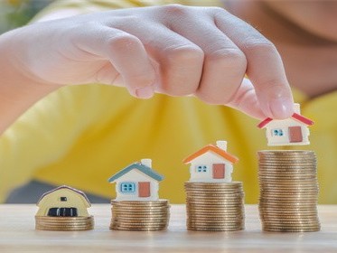 买房首付是按评估价还是交易价